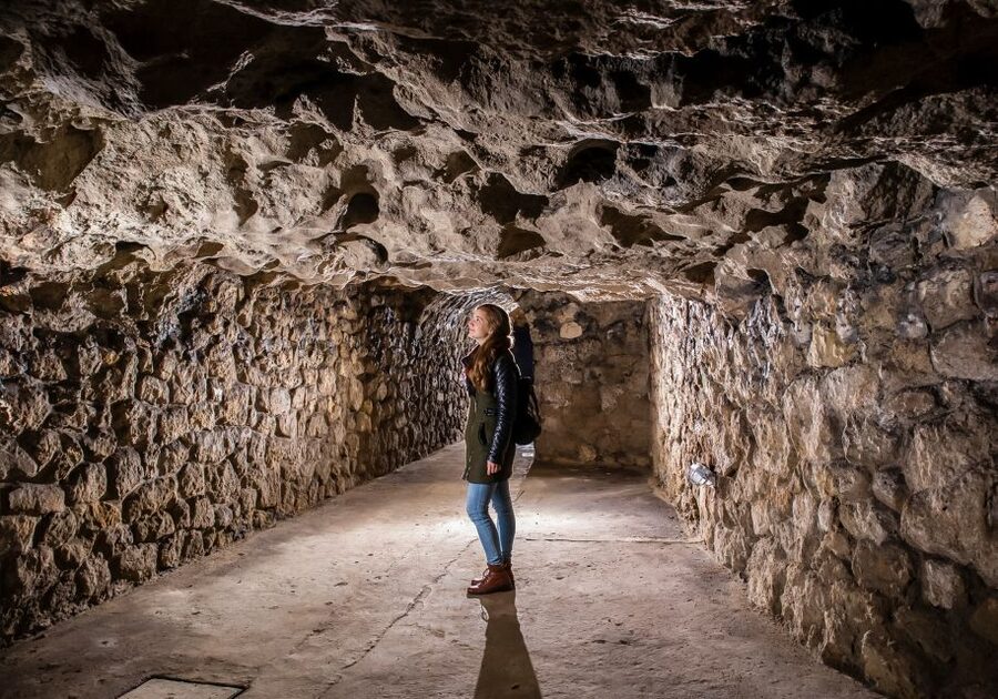 Budapest: Buda Castle Cave Tour - The big historical chapters you pass through, wine cellars to wartime shelters
