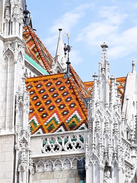 Budapest: Buda Castle Walking Tour & Folk Music Performance - Government buildings and the Pest view, plus a funicular clue