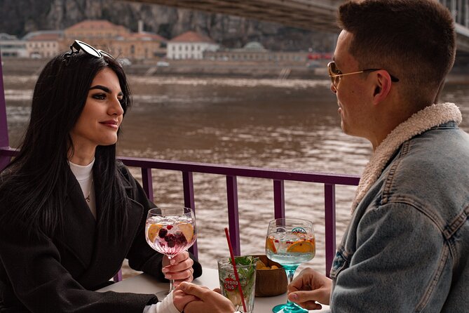 Cocktail Cruise and City Views on the Danube in Budapest - Onboard experience: tokens, table service, and cocktail realities