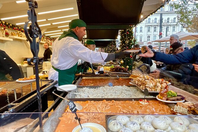 Private Budapest Christmas Market Tour with Chimney Cake & Mulled Wine - What it feels like to pass landmarks like Gresham Palace